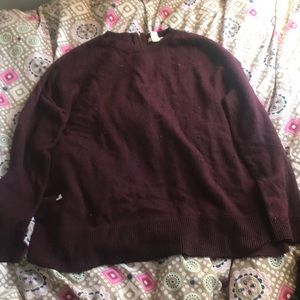 A maroon sweater.